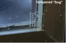 example photo of the tempered "bug" etched into tempered glass to signify it is tempered